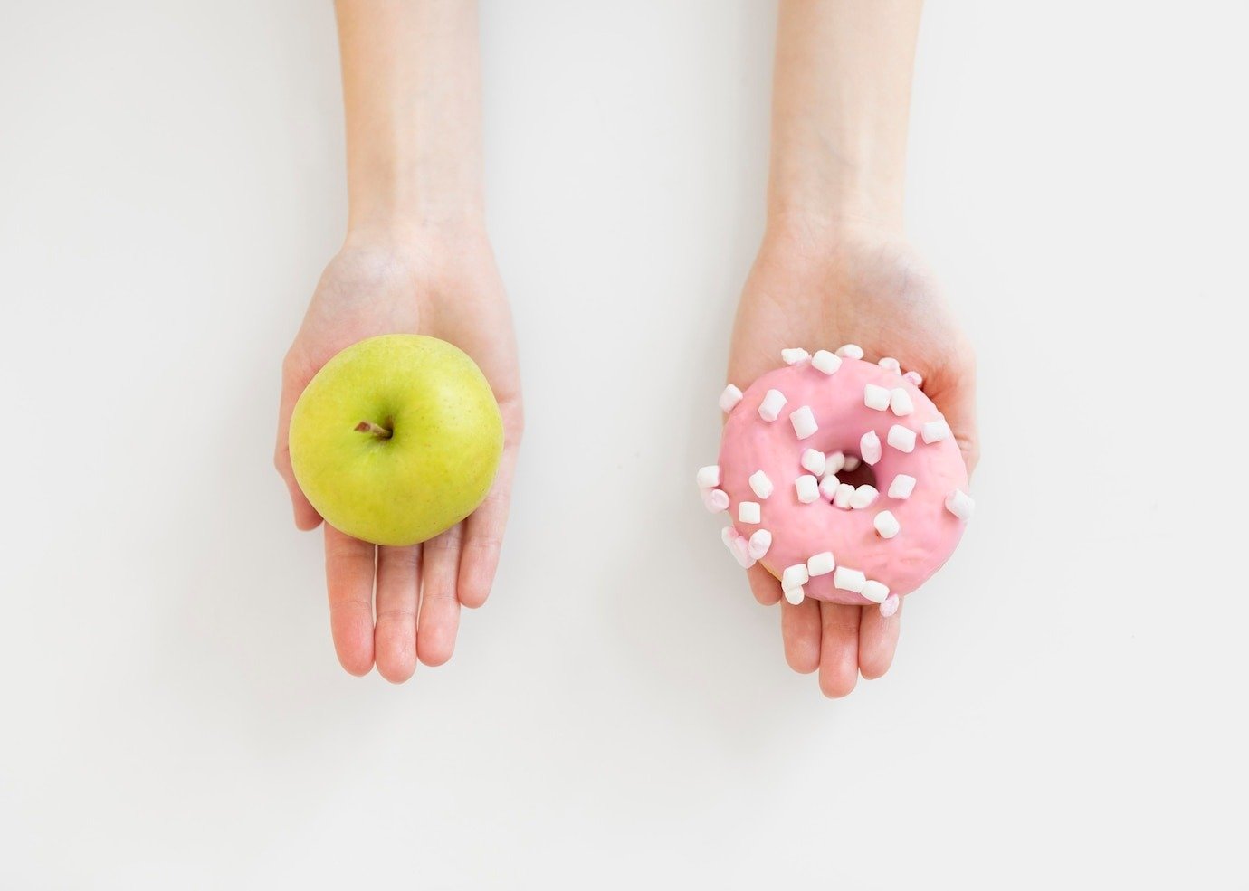close up hands holding doughnut